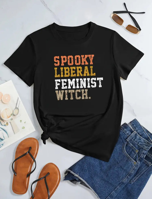 Black t-shirt with 'Spooky Liberal Feminist Witch' text on a white background with sandals and denim shorts.