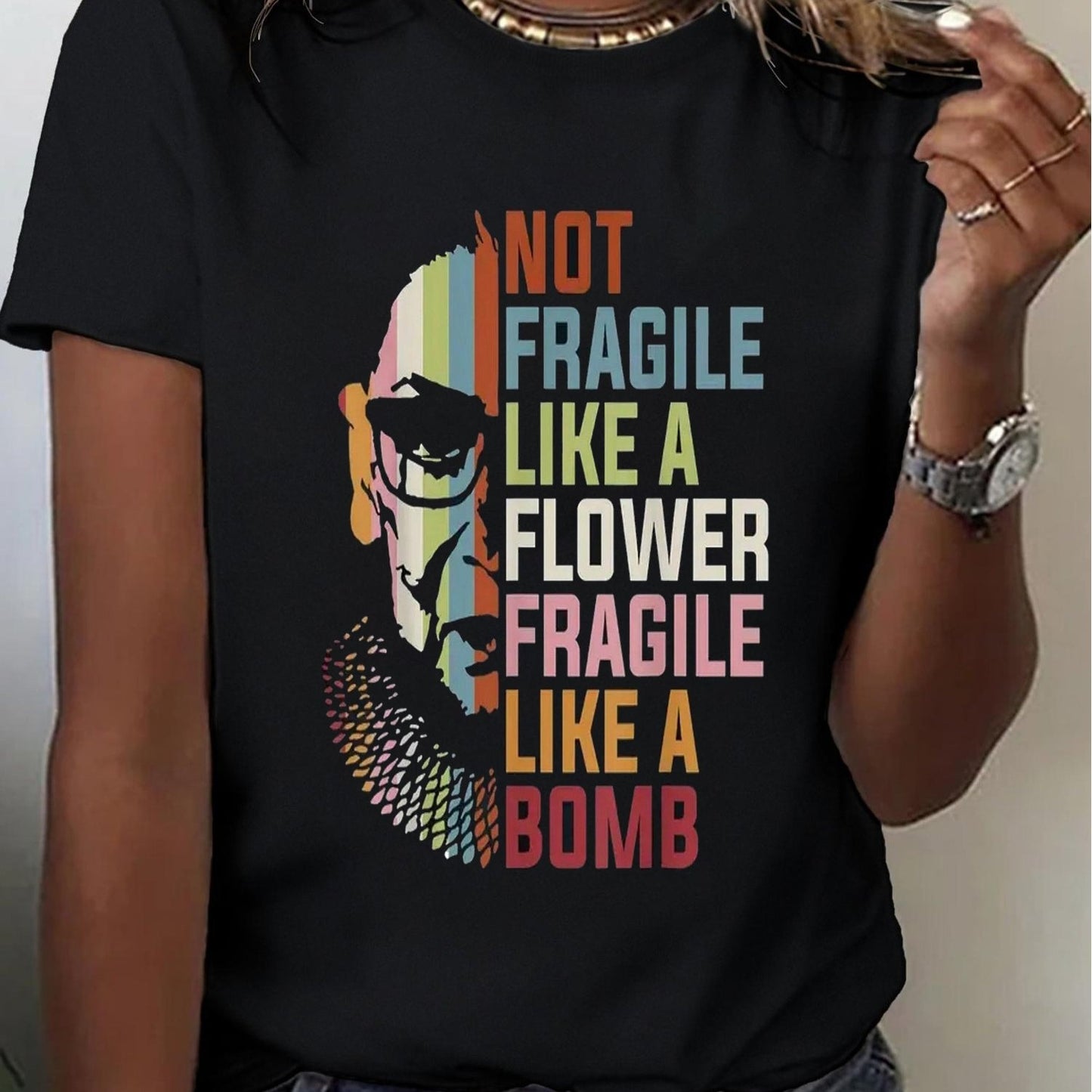 One Of My Faves! Women's Black T-Shirt With A Split picture of The Notorious RBG & "Not Fragile Like A Flower..." - Grab Them By The Midterms